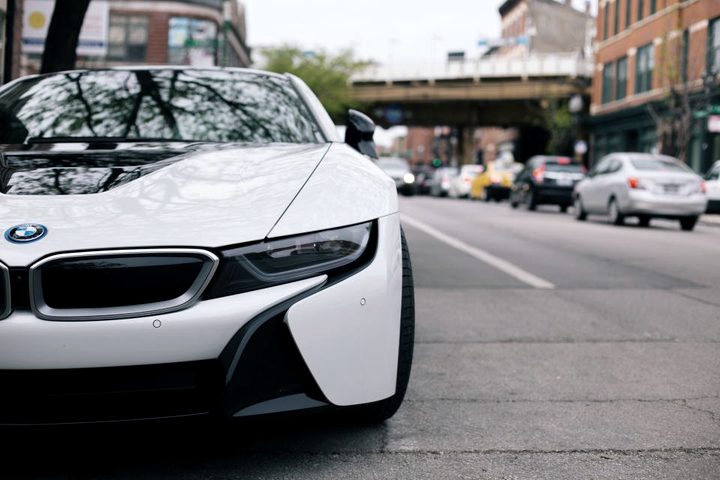 A hybrid car parked on a street